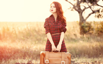 woman with suitcase in hand