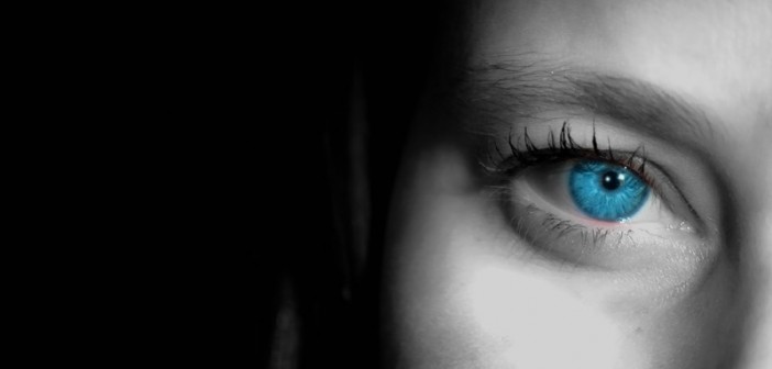 closeup of woman's face blue eye
