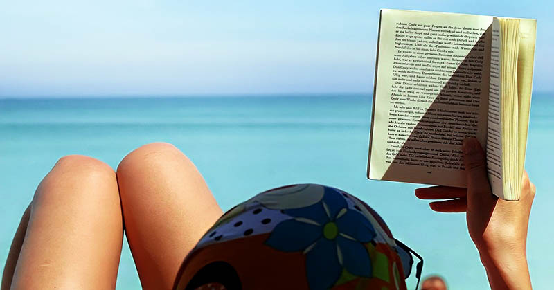 woman reading beach