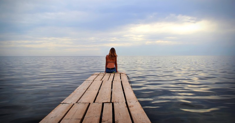 woman alone on jetty