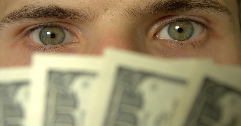 greedy man with money