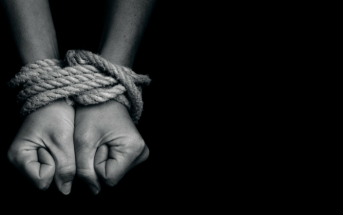 hands bound with rope - slave