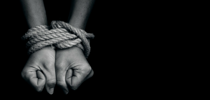 hands bound with rope - slave