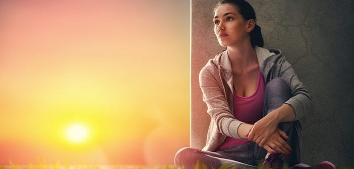 woman sitting down after exercise
