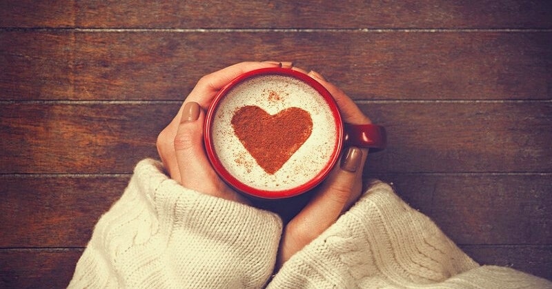 woman with coffee heart shape