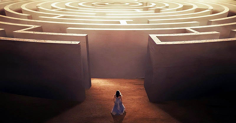 woman entering maze - concept of self-improvement