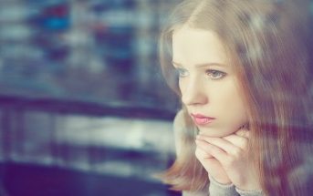 thought woman at window - concept of self-limiting beliefs