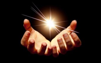 hands holding light - concept of lightworker