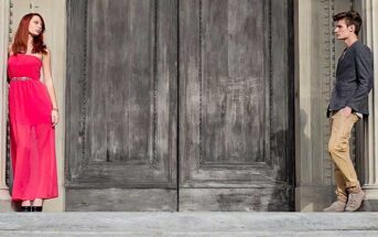 couple standing either side of door - concept of lack of empathy in a relationship