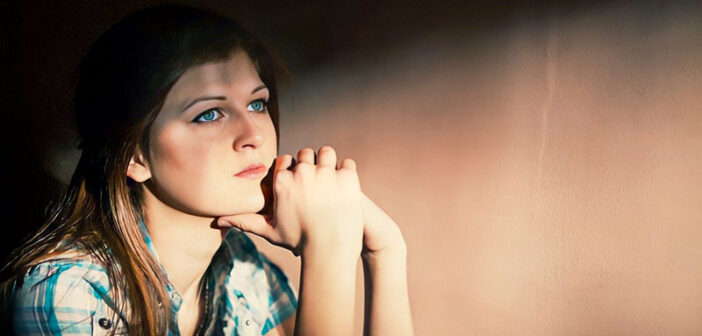 sad, thoughtful looking woman - concept of existential crisis