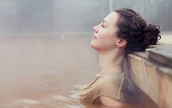 woman relaxing in natural spring - concept of highly sensitive person