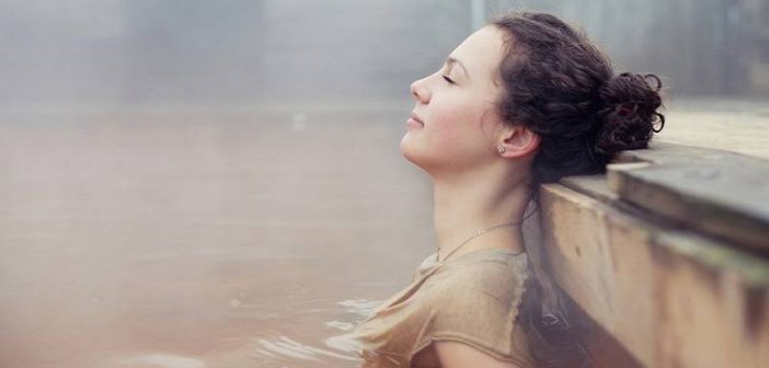 woman relaxing in natural spring - concept of highly sensitive person
