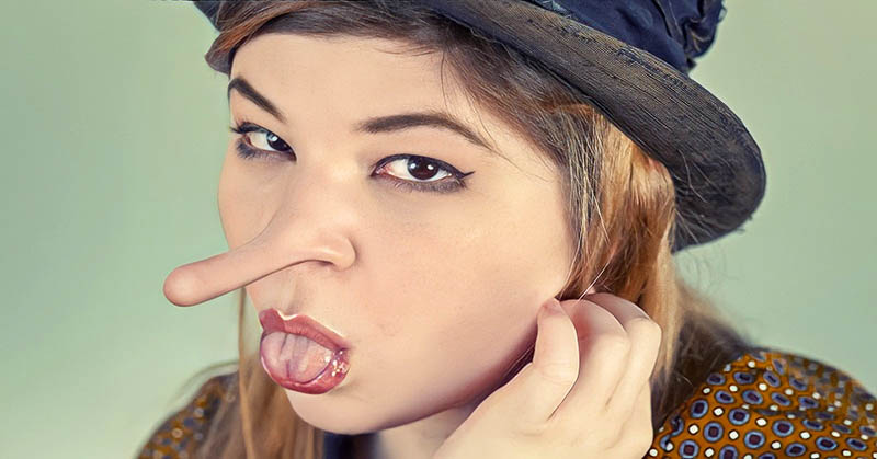 woman with Pinocchio nose - concept of lying