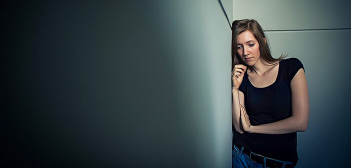 young woman with troubles on her mind signifying emotional pain
