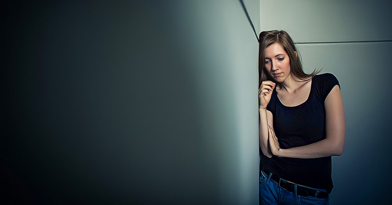 young woman with troubles on her mind signifying emotional pain