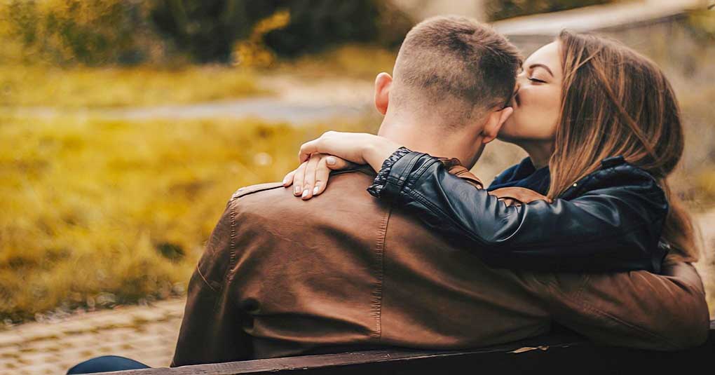 couple in love sitting on bench