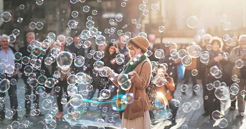 woman surrounded by bubbles not taking life seriously