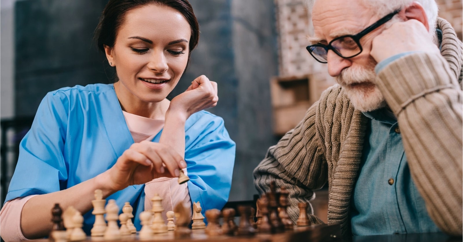 an empath working as a social worker, she is playing chess with an elderly man