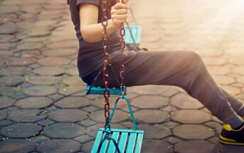 lonely woman on playground swing who has driven her friends away