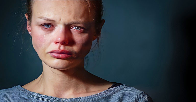 woman with sad, tearful face