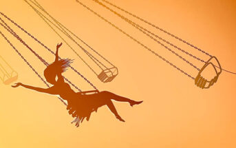 silhouette of young woman on swing against orange sky, showing her inner child