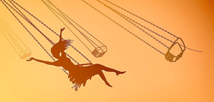 silhouette of young woman on swing against orange sky, showing her inner child