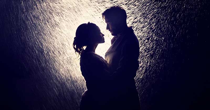 silhouette of couple in the rain signifying unrealistic expectations in a relationship