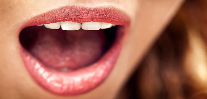 closeup of woman with open mouth - concept of speaking clearly
