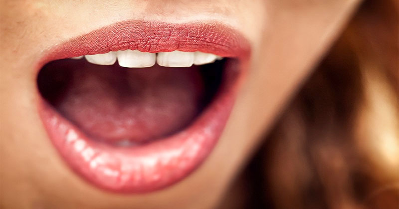 closeup of woman with open mouth - concept of speaking clearly