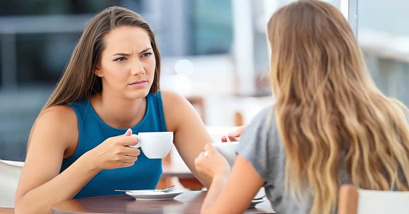 friends having coffee - one friend realizing she doesn't like the other anymore