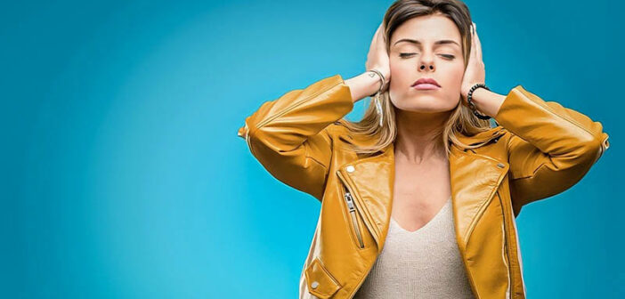 woman covering her ears to signify avoiding the drama of others