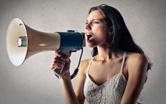 woman with megaphone indicating attention-seeking behavior