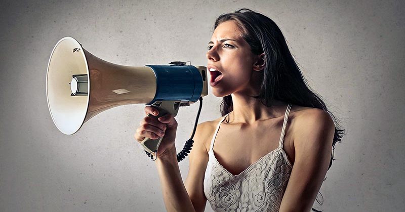 woman with megaphone indicating attention-seeking behavior