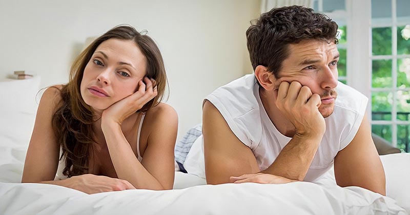 couple looking bored in a relationship with no intimacy