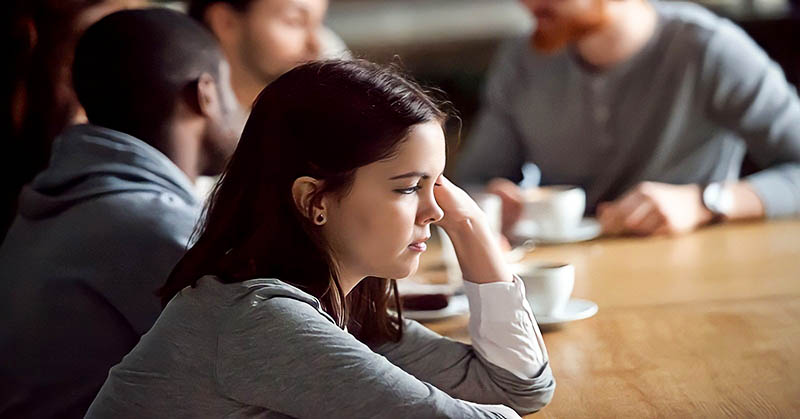 young girl being shunned from group conversation - no one is listening to her