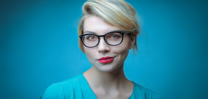 young blonde woman looking proud of herself