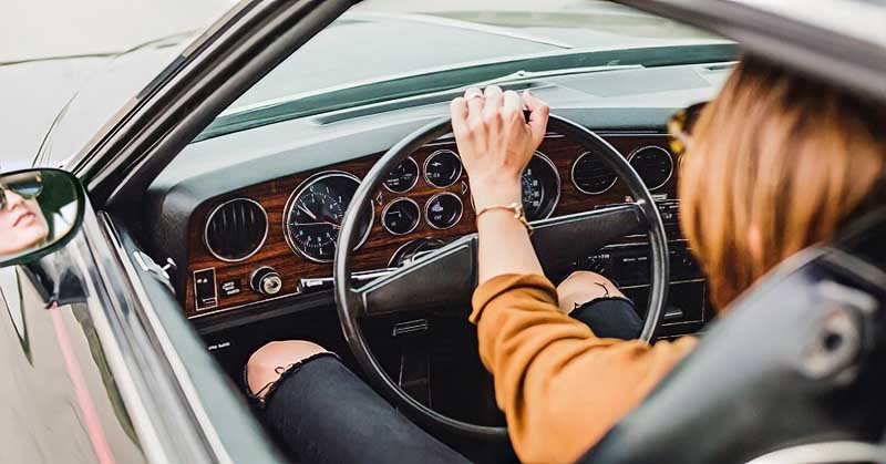 woman behind steering wheel illustrating taking responsibility for your life