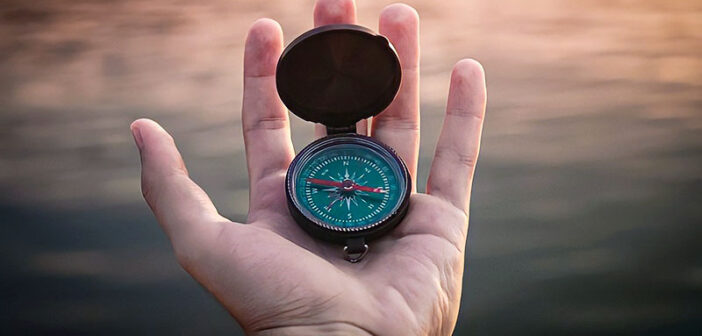 hand holding moral compass illustrating a life lived with integrity