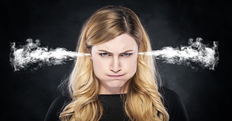 Woman with steam coming out of her ears illustrating her annoyance