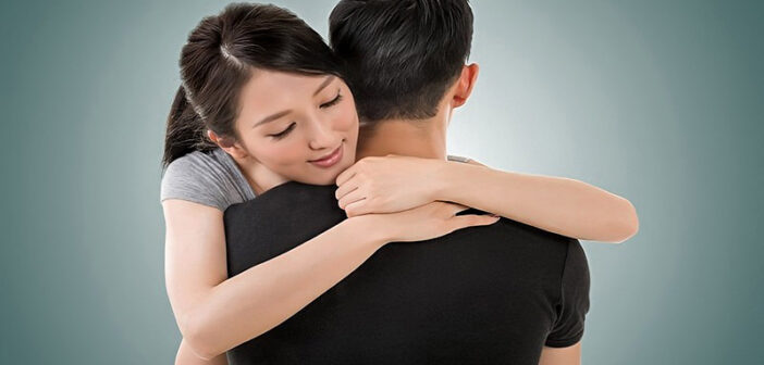 clingy girl hugging boyfriend tightly
