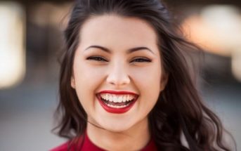 woman smiling after reading these smile quotes