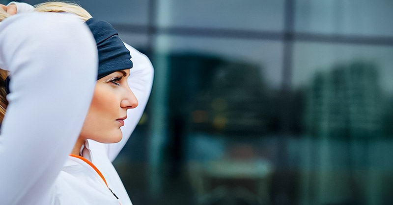 woman about to go jogging - illustrating the idea of forming a habit