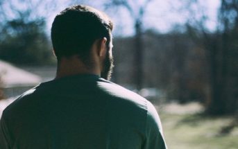 man looking into distance illustrating pulling away from a partner