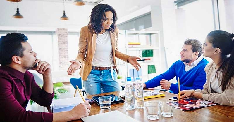 woman in business meeting not explaining things well