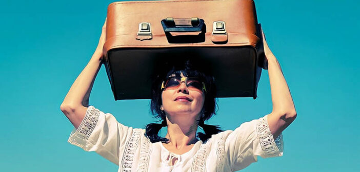 middle-aged woman holding suitcase above her heard illustrating leaving everything behind to start a new life