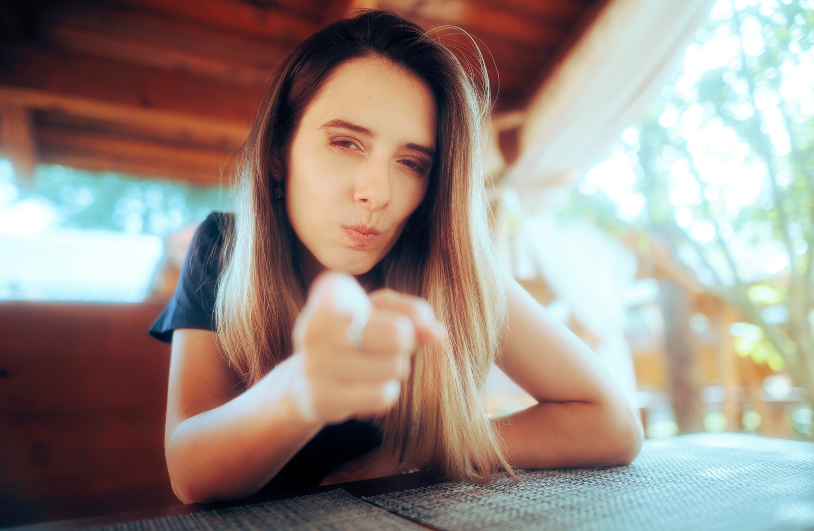 woman wagging finger to threaten someone