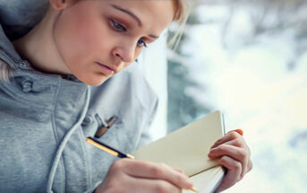 young woman journaling