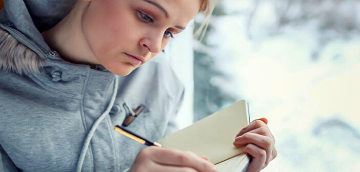 young woman journaling