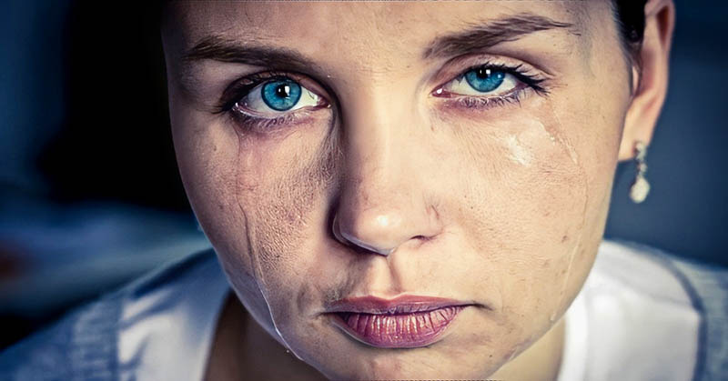 closeup of crying woman with tears running down her face