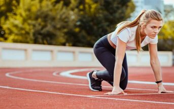 female runner under starters orders illustrating motivation